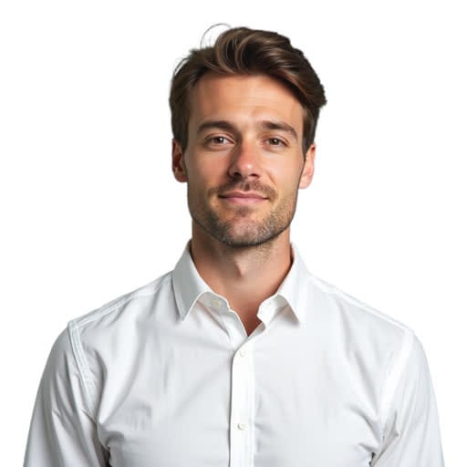 A man with short brown hair and light stubble is wearing a white button-up shirt and standing against a plain white background.